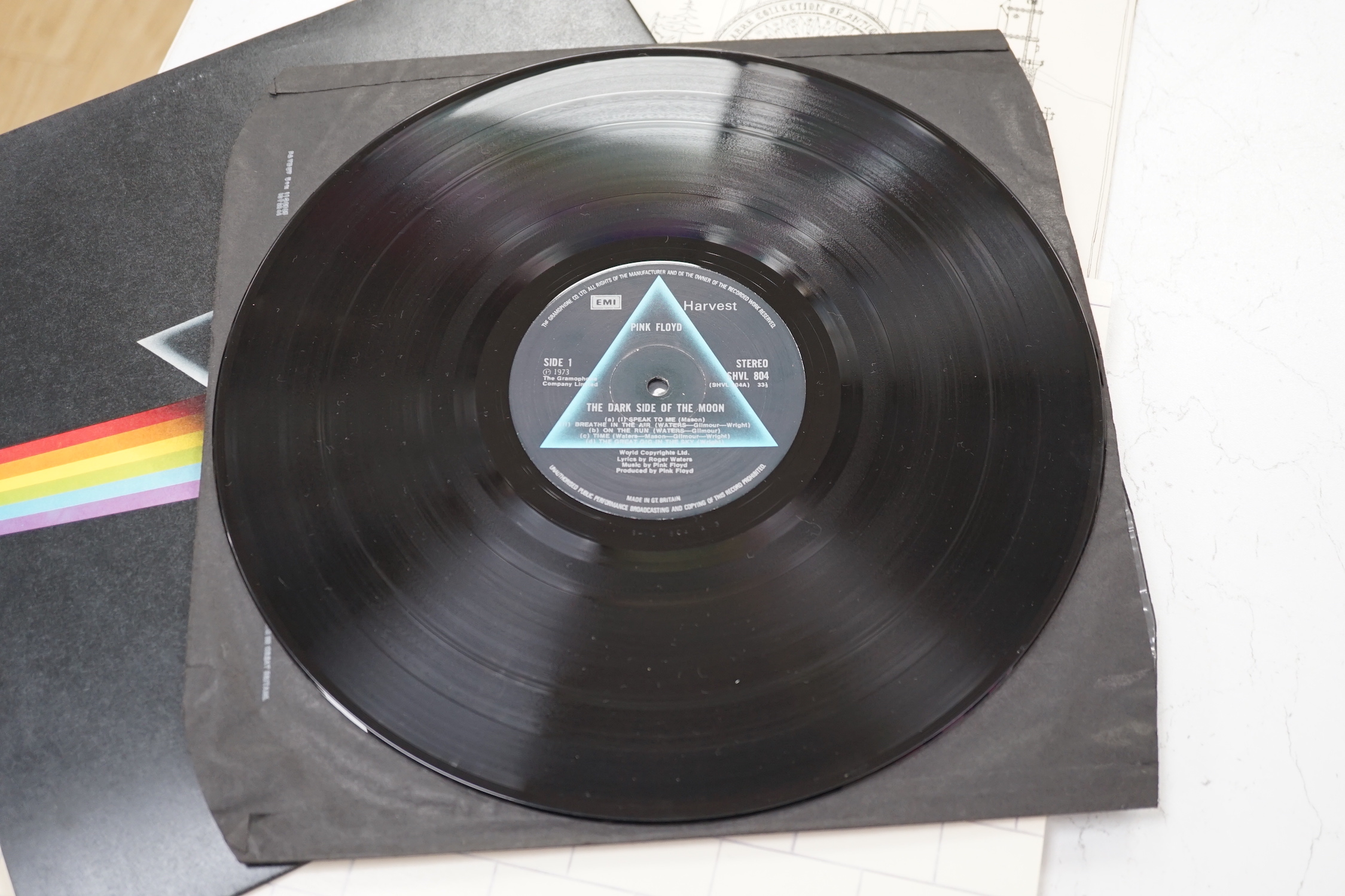 Three Pink Floyd LP record albums; Dark Side of the Moon, on Harvest SHVL 804, with both posters and black inner sleeve, The Wall, on Harvest SHSP 4111 A 2U, Relics, on Starline, SRS 5071